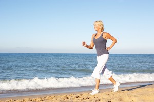 Fit woman running on the beach